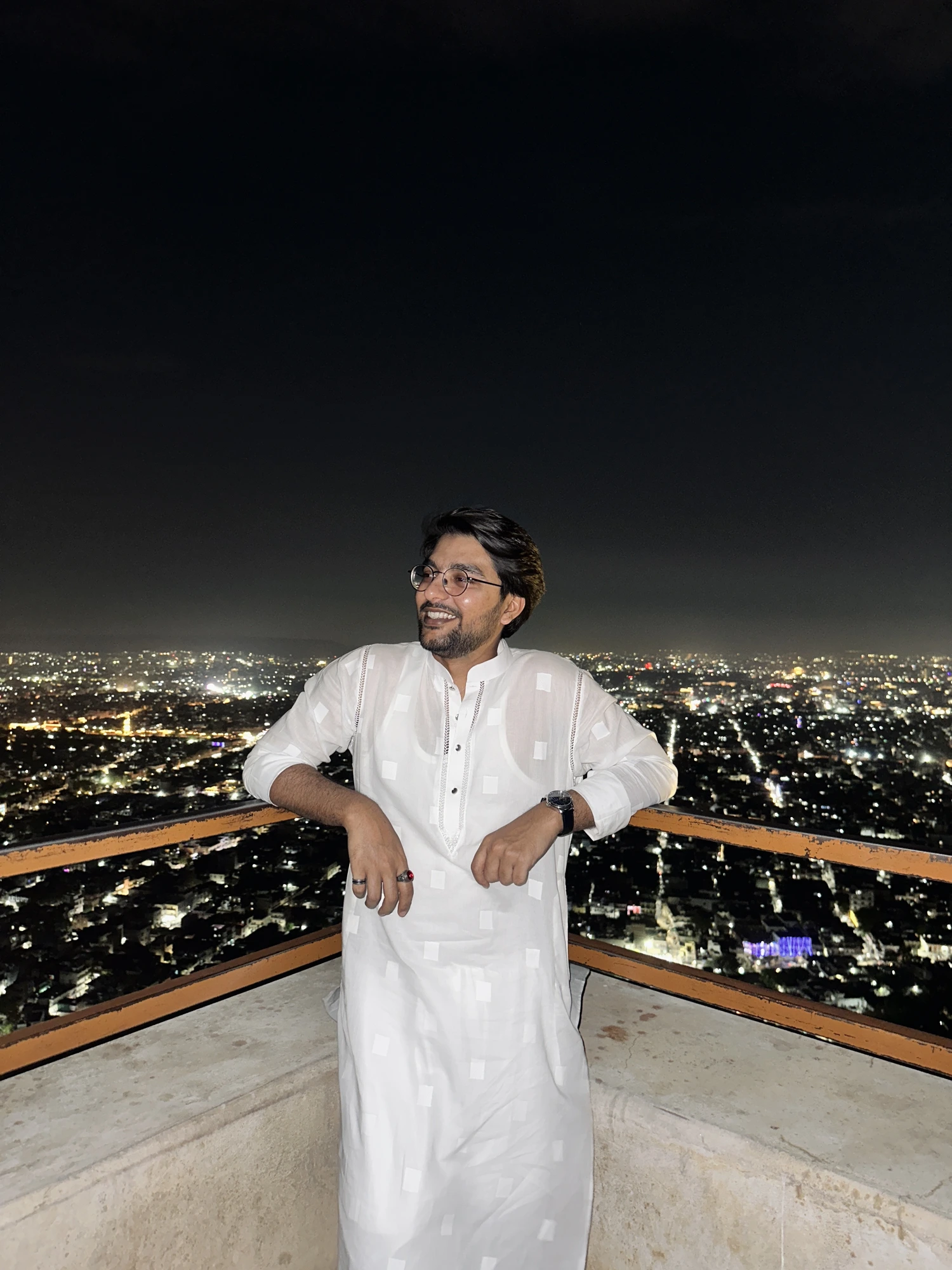 Anas Khan, founder of Unzip Delhi, overlooking the city at night